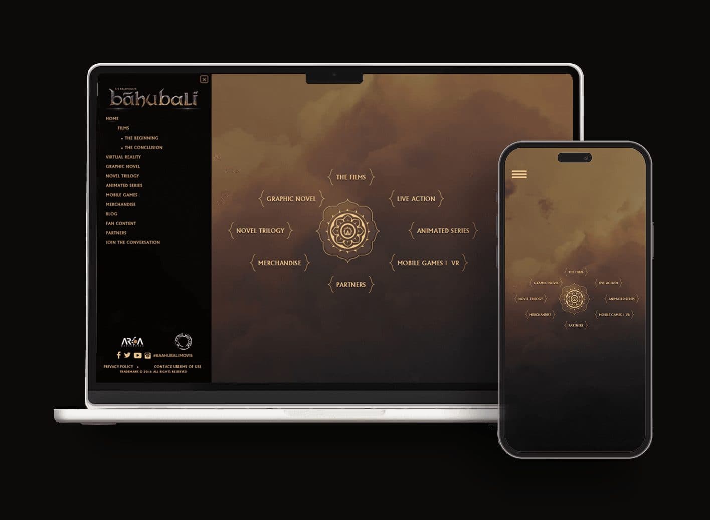 The Baahubali.com home screen on a laptop and a phone: a sidebar listing films, virtual reality, graphic novel, novel trilogy, animated series, mobile games, merchandise and partners, beside a circular emblem with those worlds arranged around it.